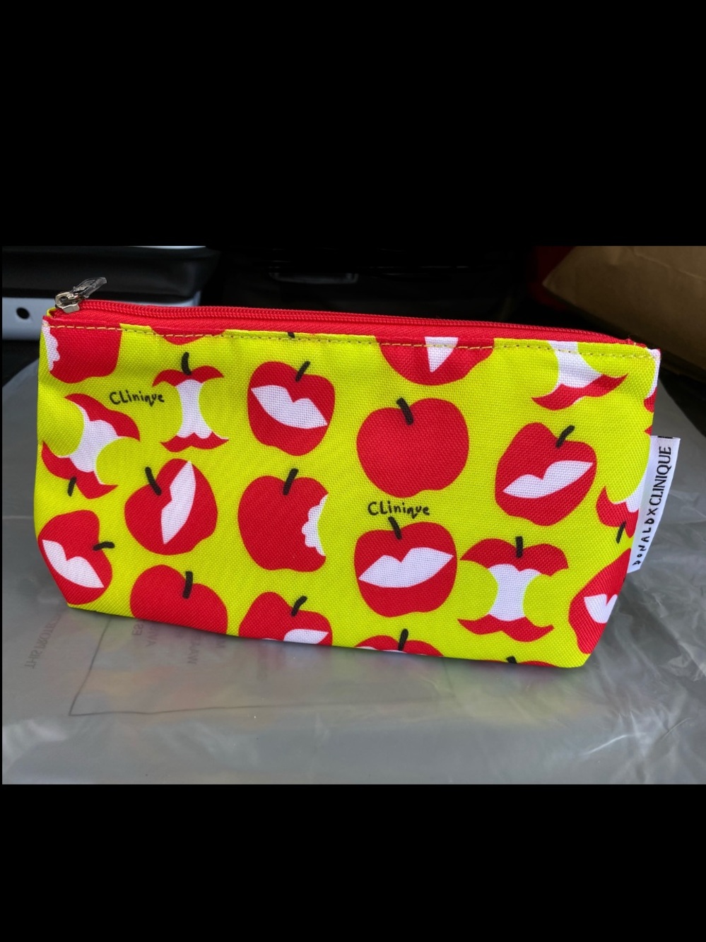 Brand new Clinique Yellow Cosmetic Pouch with Red Apple Motif
